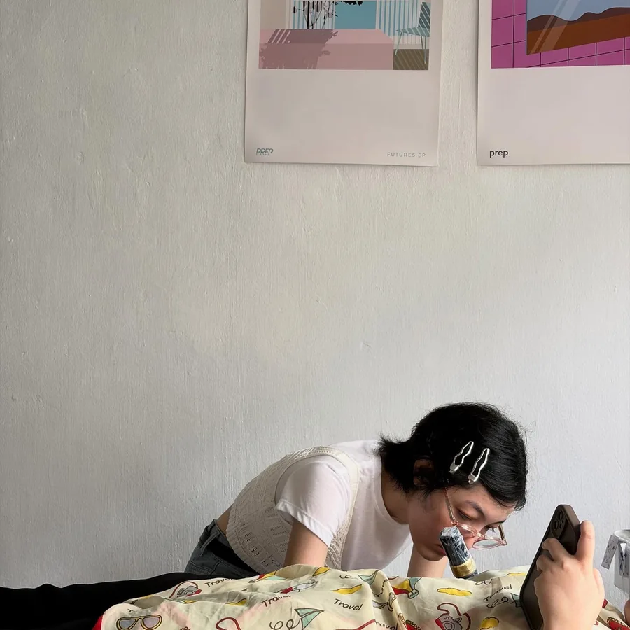 The artist concentrating on the tattoo in the studio