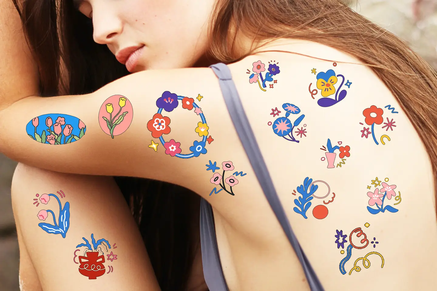 Colourful naive floral tattoos on a shoulder by Naive Flora Bangkok